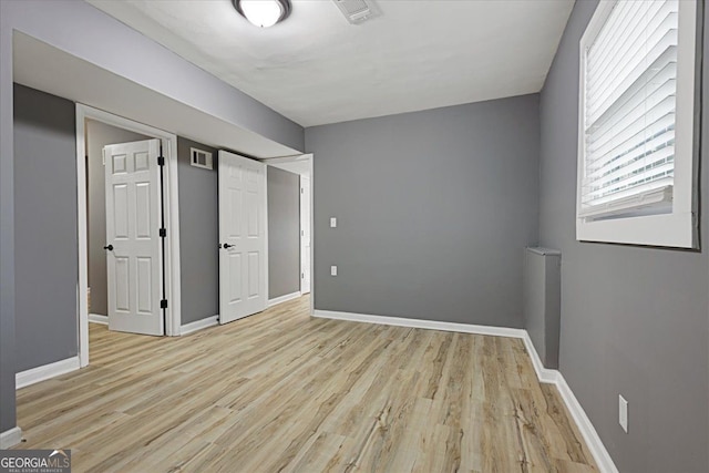 unfurnished bedroom featuring light hardwood / wood-style floors