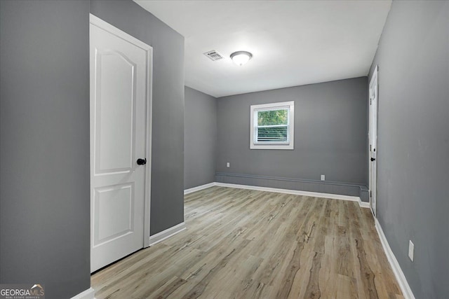 unfurnished room featuring light hardwood / wood-style flooring