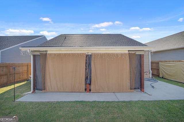 back of property featuring a lawn