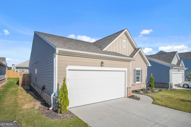 view of front of house featuring a garage and a front lawn