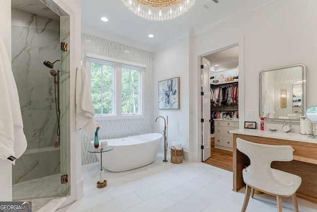 bathroom with vanity, crown molding, and plus walk in shower