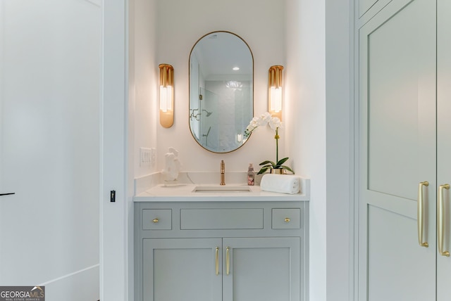 bathroom featuring walk in shower and vanity