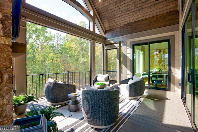 sunroom featuring wood ceiling and vaulted ceiling