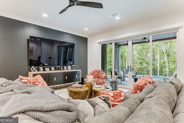 living room with ceiling fan, hardwood / wood-style floors, crown molding, and plenty of natural light