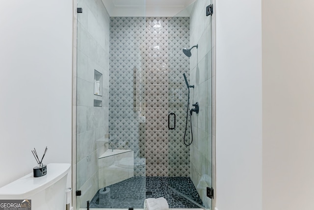 bathroom with walk in shower and toilet