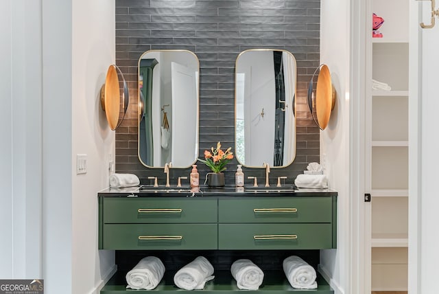 bathroom featuring tasteful backsplash and vanity