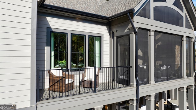 view of side of home featuring a balcony