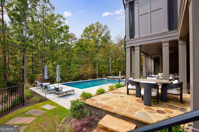 view of pool featuring a patio area