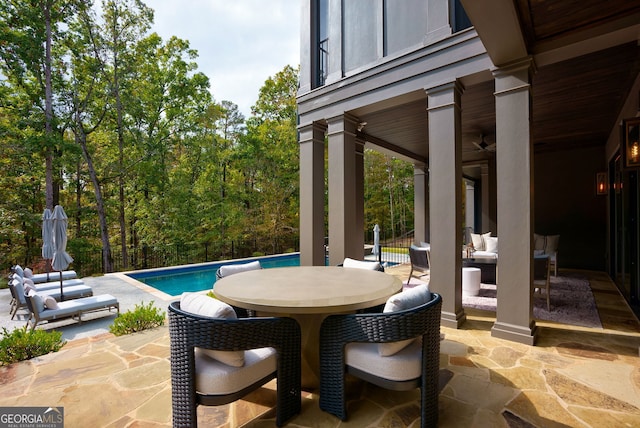 view of patio with ceiling fan and an outdoor living space