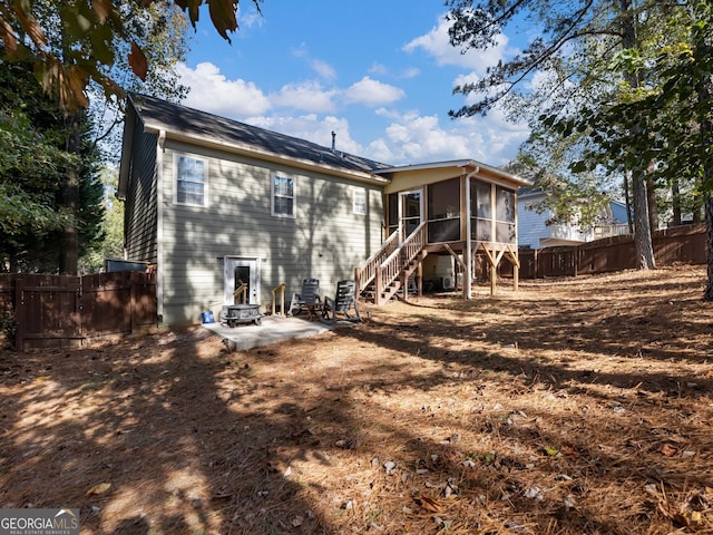 back of house with a patio and a sunroom