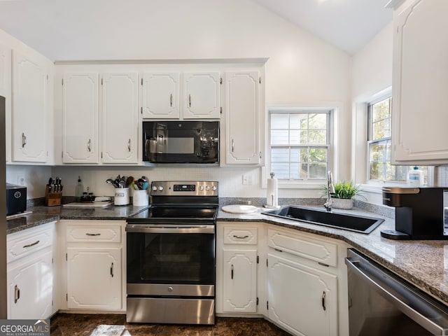 kitchen featuring white cabinets, sink, lofted ceiling, and stainless steel appliances