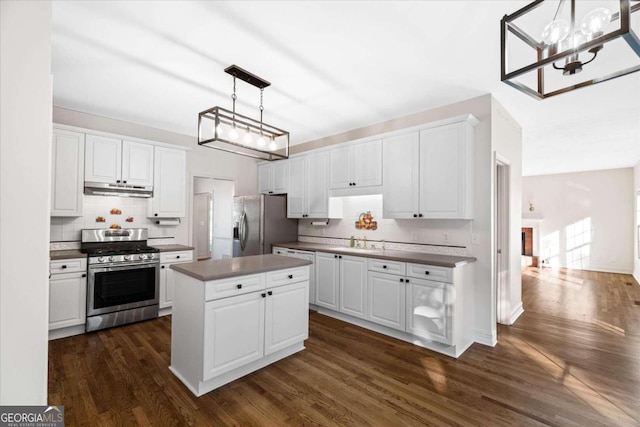 kitchen featuring white cabinetry, dark wood-type flooring, and appliances with stainless steel finishes