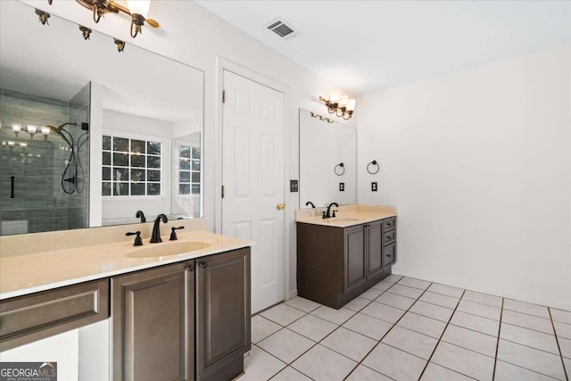 bathroom featuring vanity, tile patterned floors, and a shower with shower door