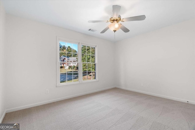 carpeted empty room with ceiling fan