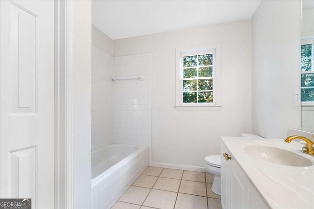 full bathroom with tile patterned flooring, vanity, toilet, and tiled shower / bath combo