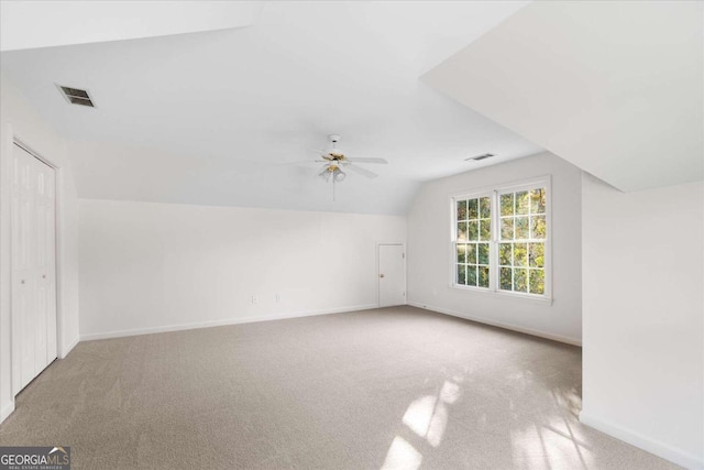 bonus room with carpet, vaulted ceiling, and ceiling fan