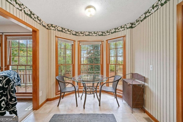 dining area with a textured ceiling