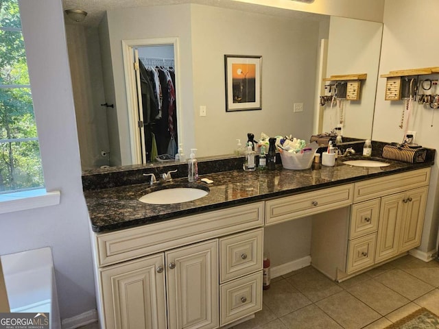 bathroom with vanity and tile patterned floors