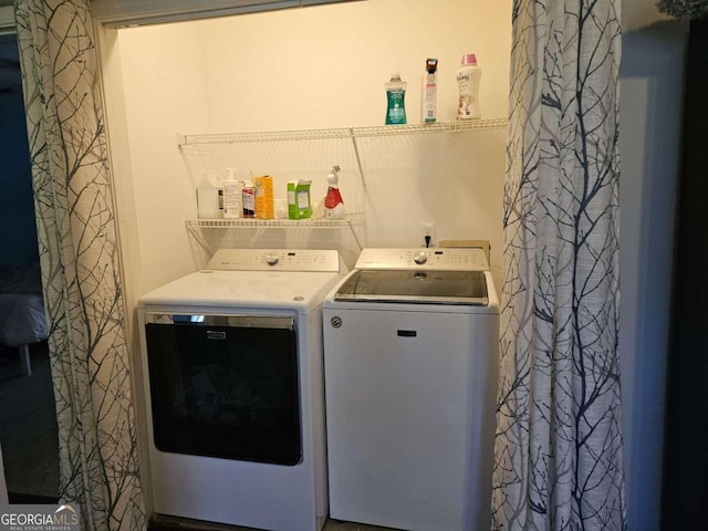 laundry area with independent washer and dryer