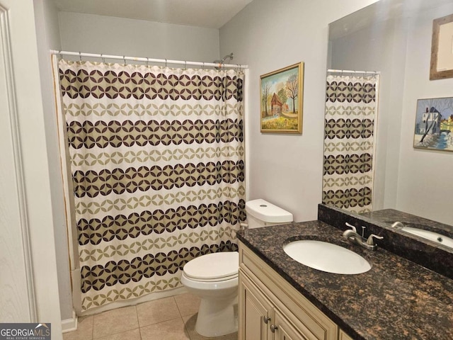 bathroom featuring vanity, tile patterned floors, toilet, and a shower with curtain