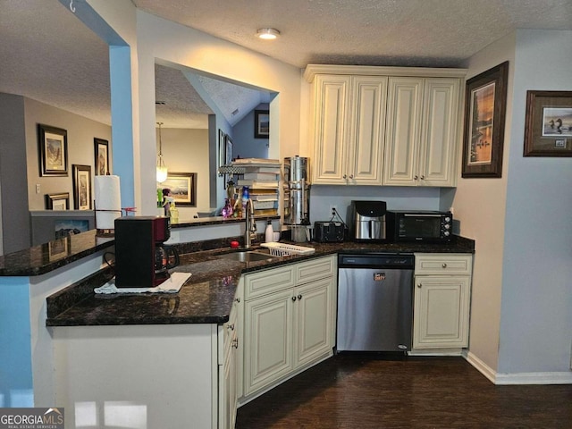 kitchen with sink, kitchen peninsula, dark hardwood / wood-style floors, a textured ceiling, and dishwasher