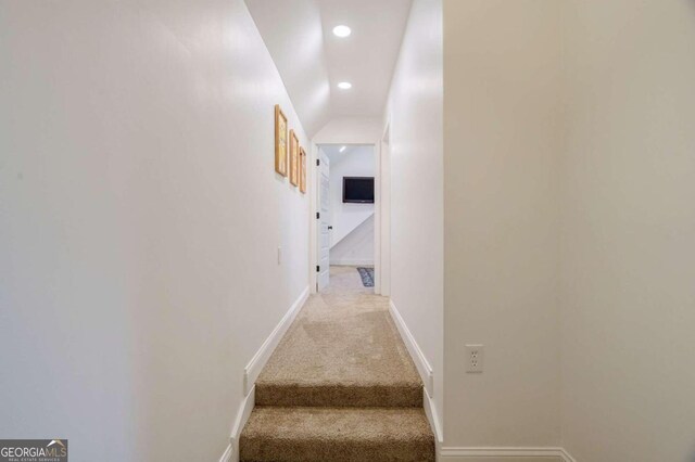 corridor with carpet flooring