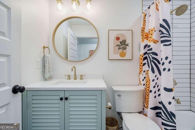 bathroom with toilet and vanity