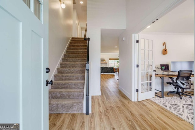 interior space featuring ornamental molding and wood-type flooring