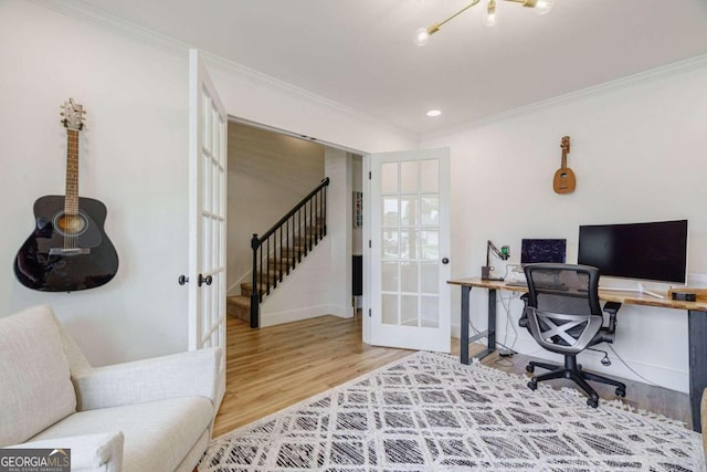 office featuring french doors, wood-type flooring, and crown molding