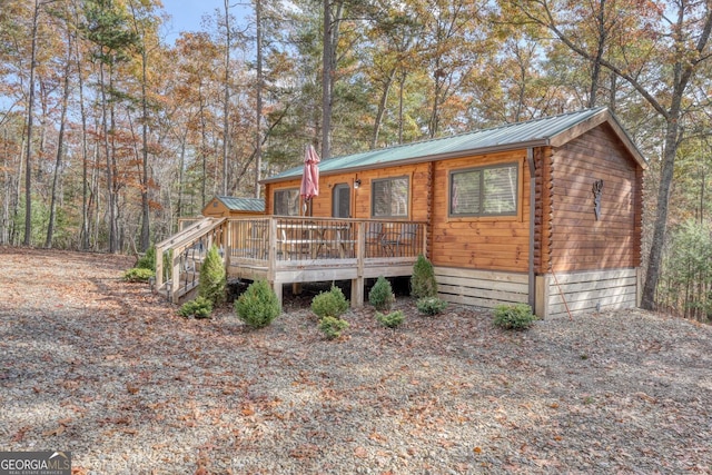 view of front of home featuring a wooden deck