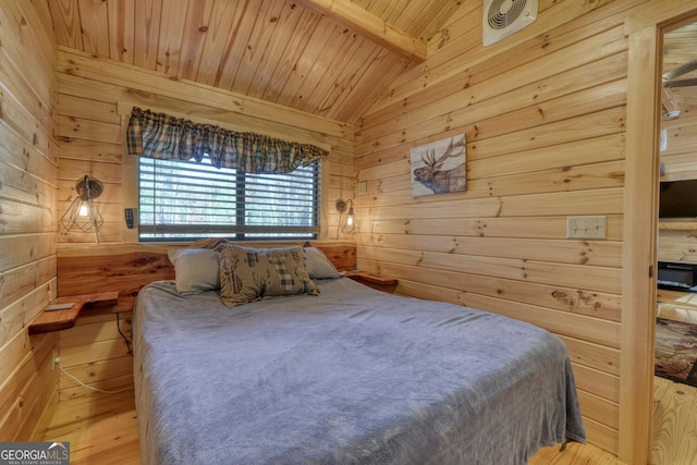 bedroom with lofted ceiling with beams, wood walls, light wood-type flooring, and wood ceiling