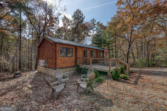 back of property featuring a wooden deck