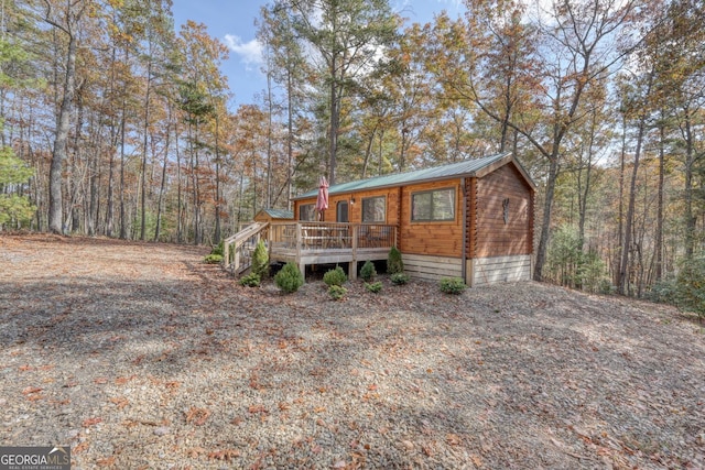 view of front of property featuring a wooden deck