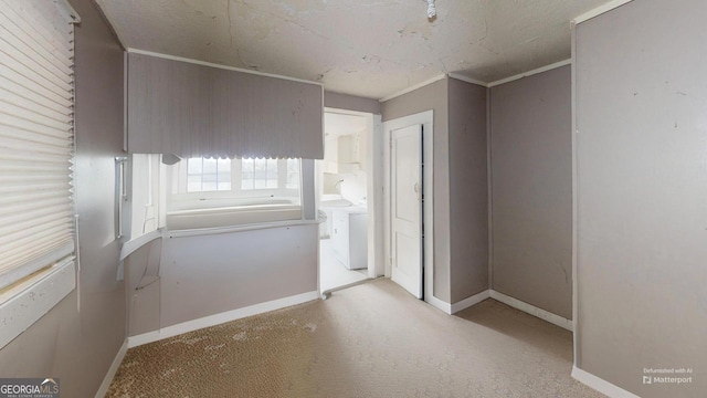 unfurnished room with washing machine and dryer