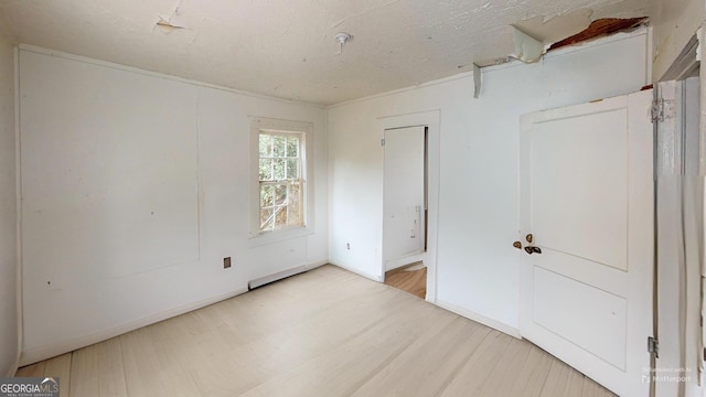 unfurnished bedroom with hardwood / wood-style floors