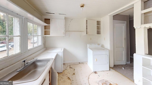 laundry area featuring washer / clothes dryer and sink