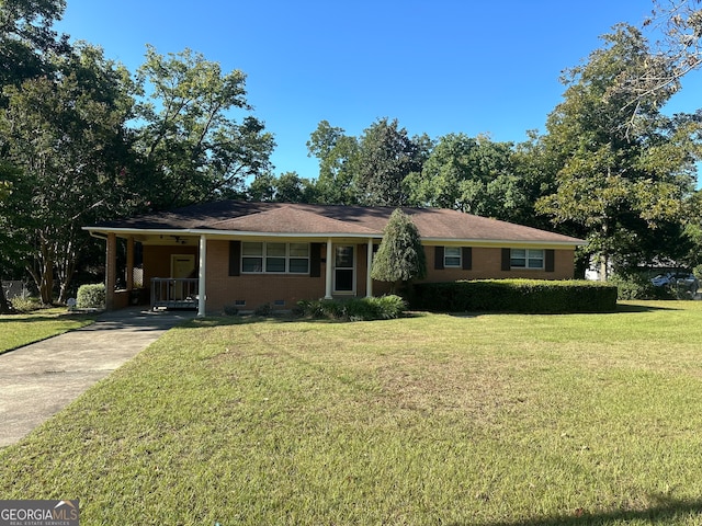 single story home featuring a front yard and a carport