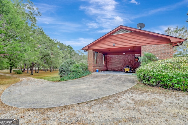 view of side of property featuring a carport