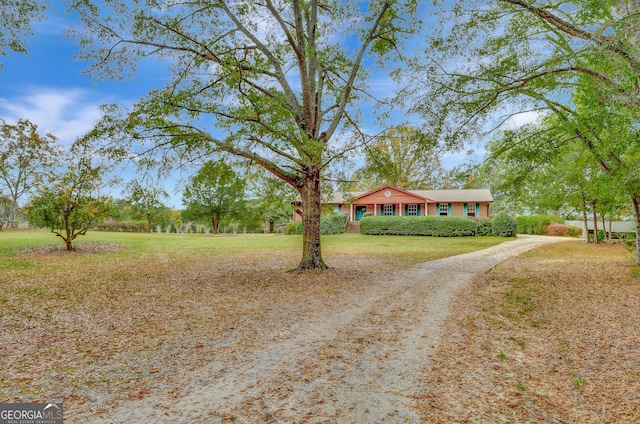 view of front of home with a front yard