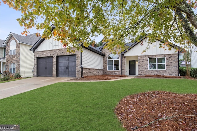 view of front of property featuring a garage and a front lawn