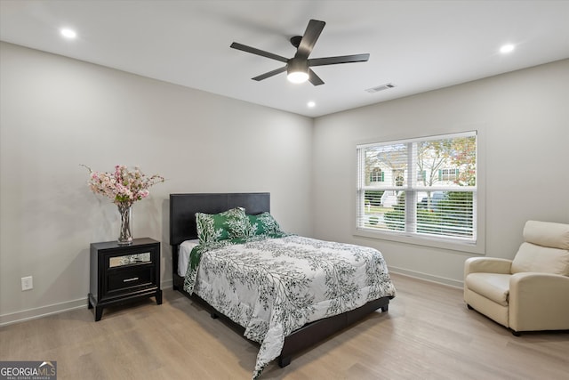 bedroom featuring ceiling fan and light hardwood / wood-style floors