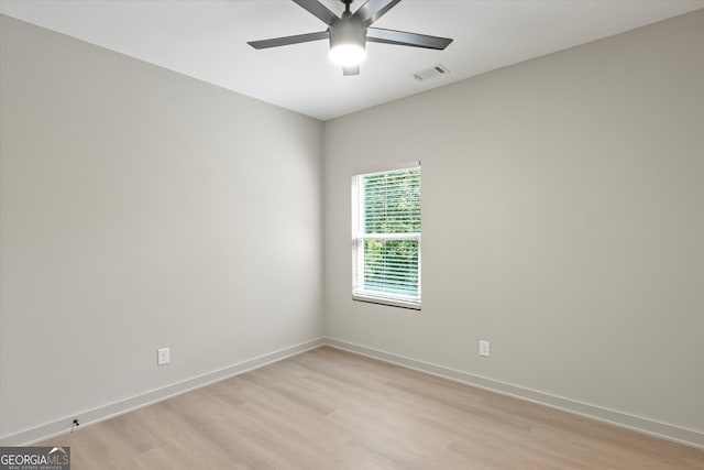 empty room featuring ceiling fan and light hardwood / wood-style floors