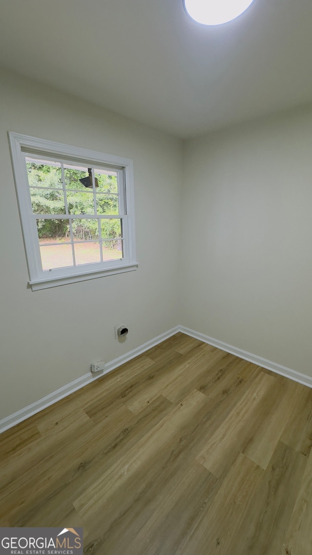 unfurnished room with light hardwood / wood-style flooring