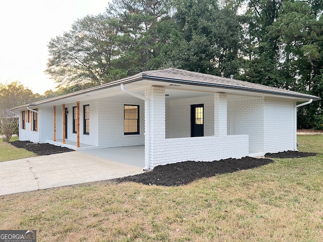 view of property exterior featuring a lawn