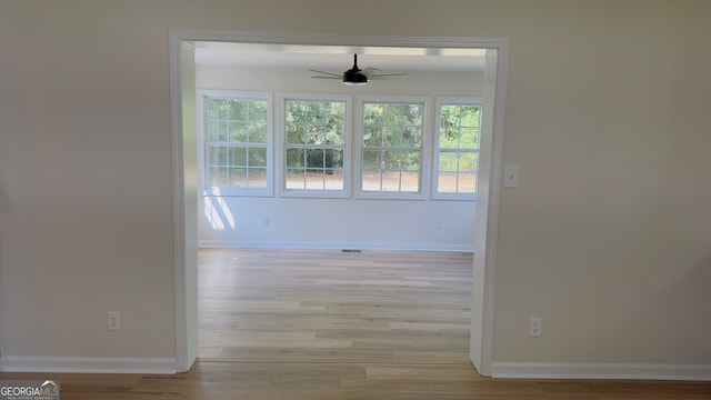 interior space featuring light wood-type flooring and ceiling fan