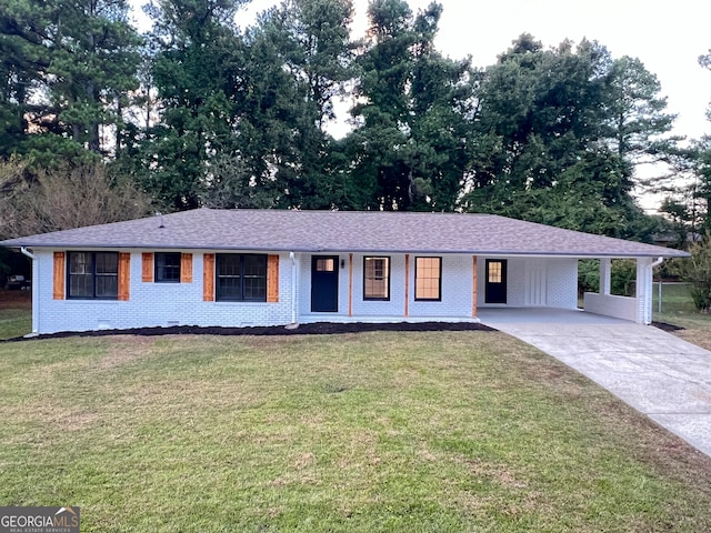 single story home with a front lawn and a carport