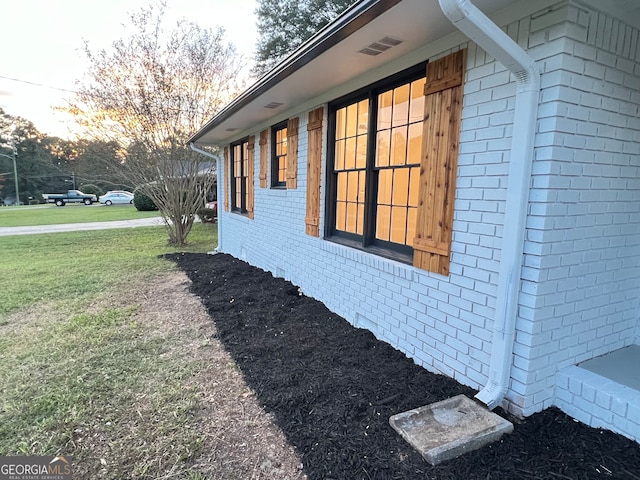 view of property exterior with a yard