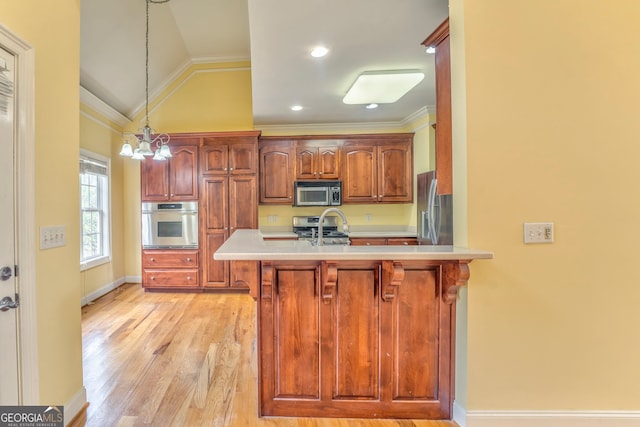 kitchen with stainless steel appliances, kitchen peninsula, hanging light fixtures, light hardwood / wood-style flooring, and lofted ceiling