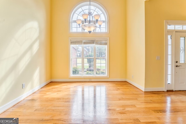 entrance foyer featuring a wealth of natural light and light hardwood / wood-style flooring