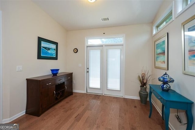 doorway with light hardwood / wood-style floors